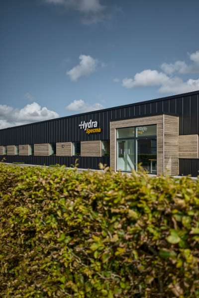 Black steel profiles and warm wood create striking contrasts on headquarters facade, Jernvej 19, 6900 Skjern, Denmark